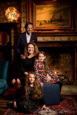 Family portrait by the fireplace